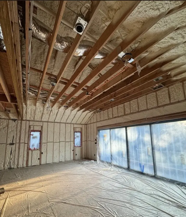 Interior walls and ceiling insulated with spray foam during new construction in Pavilion